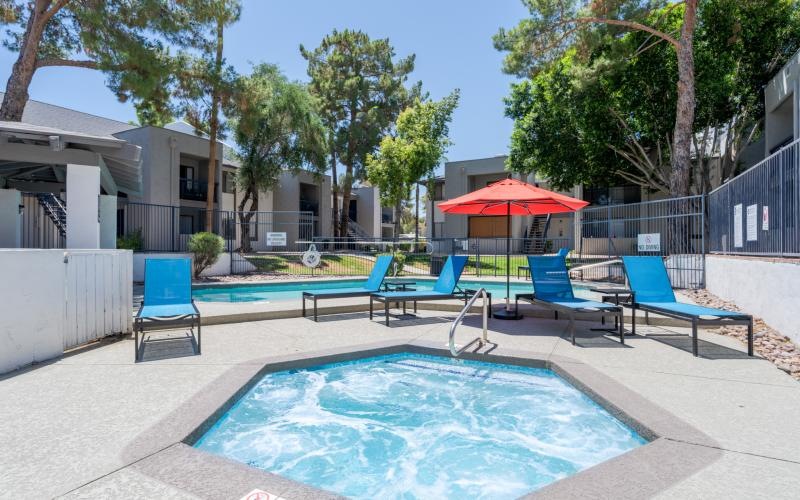 a pool with chairs around it